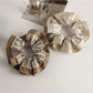 Close-up of Gifty pastel scrunchie showing gathered fabric texture in light colors