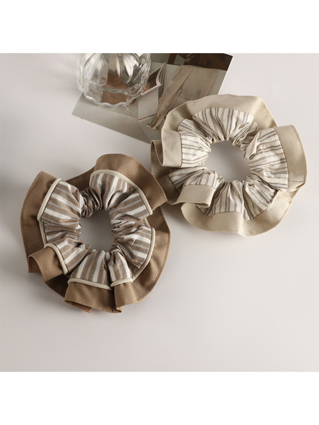 Close-up of Gifty pastel scrunchie showing gathered fabric texture in light colors