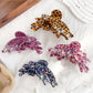 Close-up of Beau leopard print butterfly claw clip showing detailed pattern