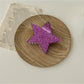 Beau star shaped claw clip with light reflection on glossy surface