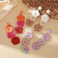 Close-up of Earedge Bohemian color block drop earrings with geometric shapes