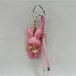 Bunny keychain held in hand showing size and scale