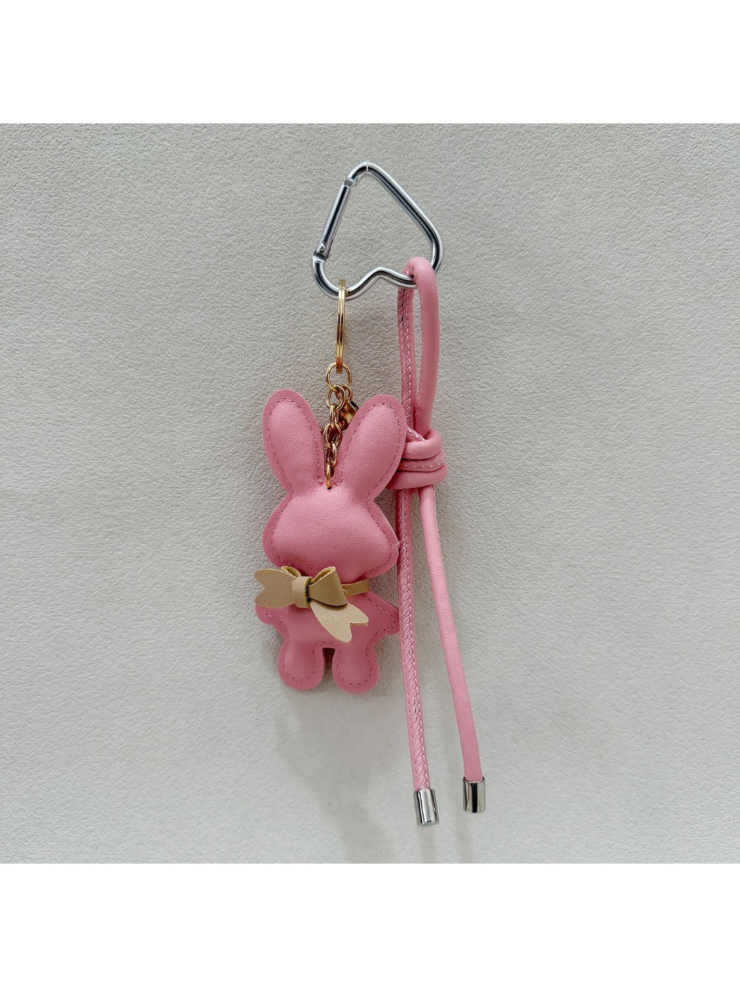 Bunny keychain held in hand showing size and scale