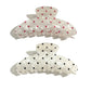 Beau polka dot updo claw clip holding brown hair in a bun