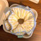 Close-up of yellow striped fabric texture on hair scrunchie
