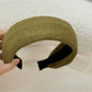 Gifty headband paired with matching accessories on a wooden surface
