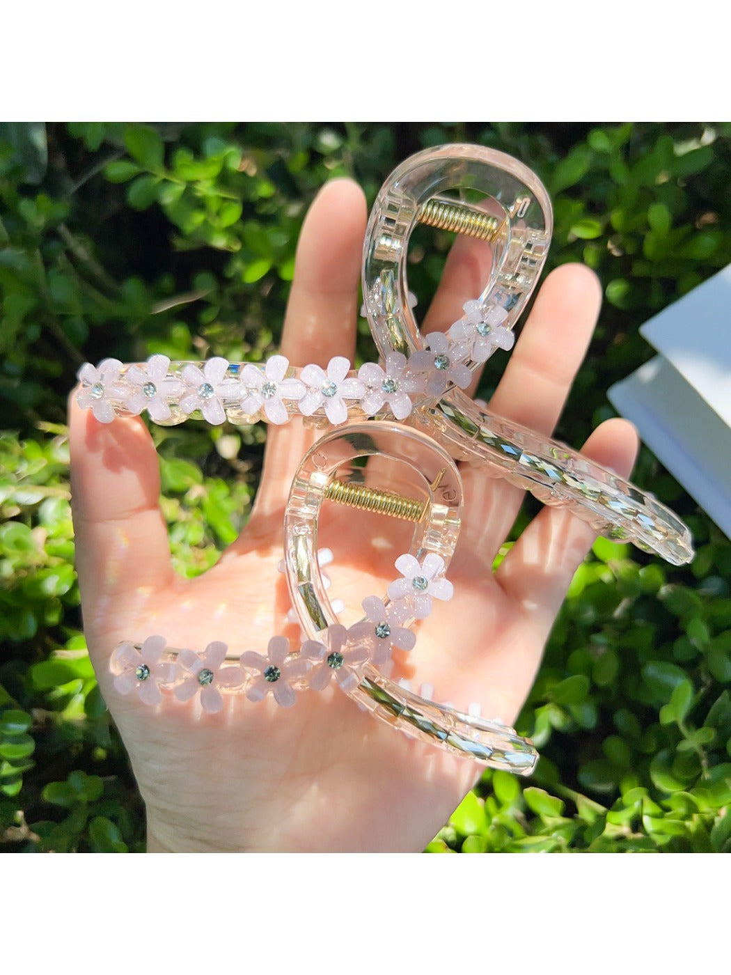 Side view of beige Beau flower crisscross hair claw clip