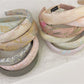 Close-up of Gifty fabric embroidered flower headband with pink and white flowers