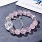 Close-up of pink crystal fox-shaped charm on Lovra bracelet