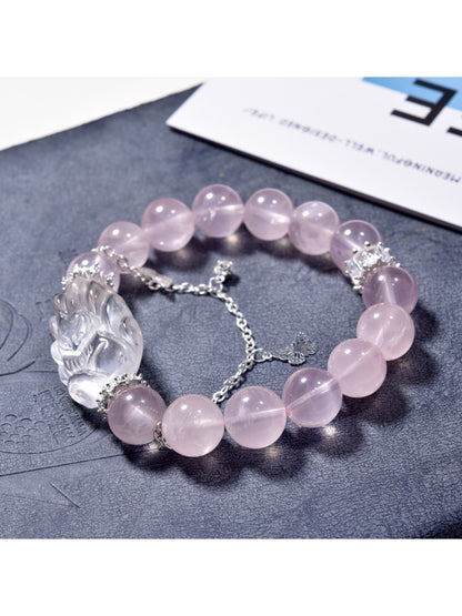 Close-up of pink crystal fox-shaped charm on Lovra bracelet