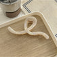 Side view of Beau Artistic Bright Hair Clip clipped in blonde hair highlighting its curved shape