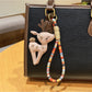 Keypus deer charm keychain displayed in a gift box with soft padding