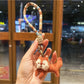 Keypus squirrel charm keychain photographed with soft natural lighting