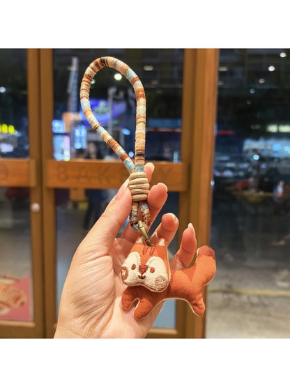 Keypus squirrel charm keychain photographed with soft natural lighting