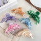 Colorful butterfly shaped hair claw clip with vibrant multicolor wings