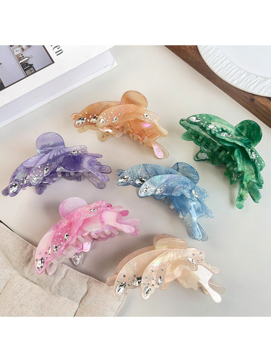 Colorful butterfly shaped hair claw clip with vibrant multicolor wings