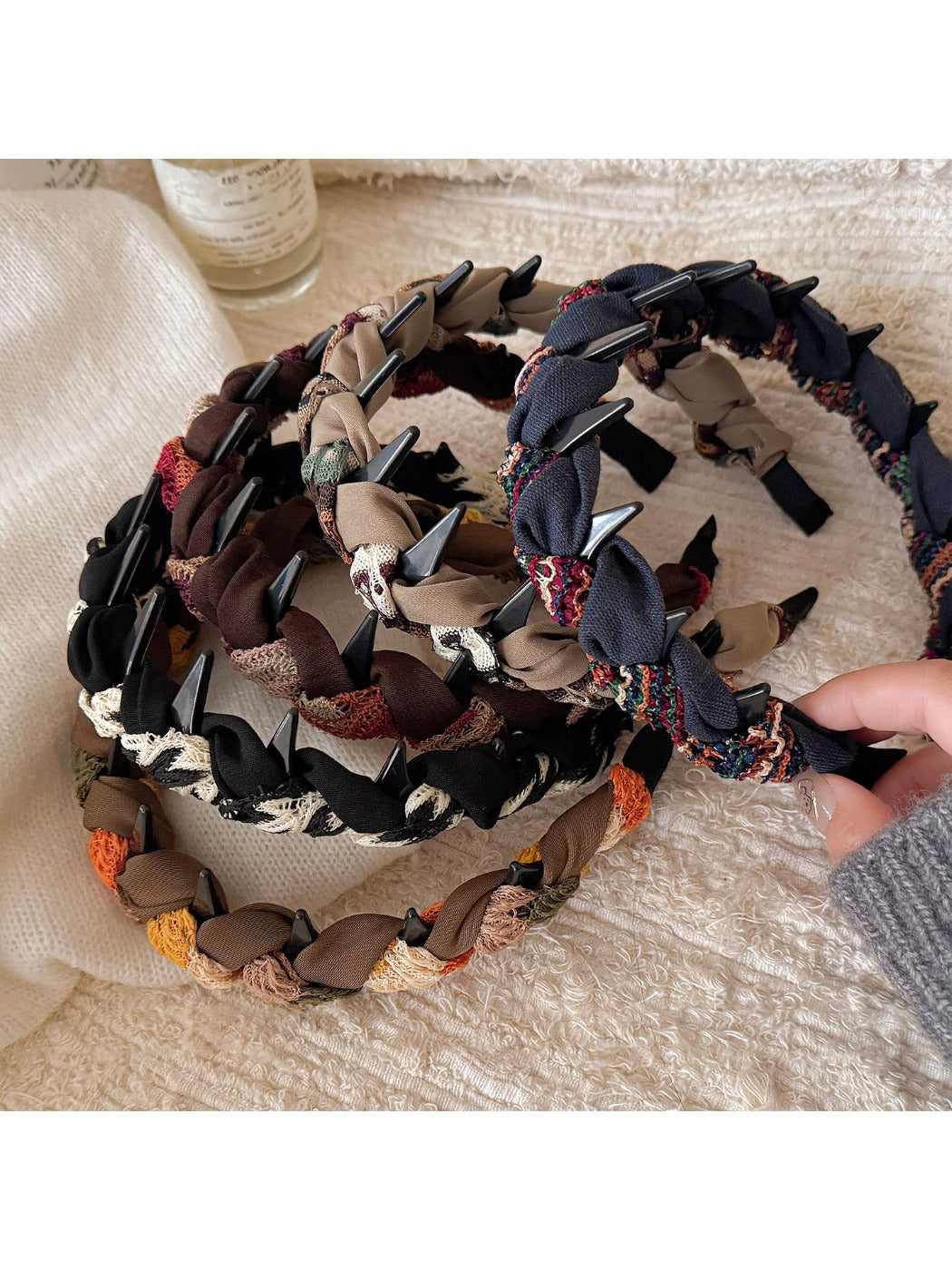 Close-up of Gifty knitted fabric wrapped headband in beige color