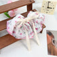 Top view of Beau Chic Sweet Bow Hair Clip showing symmetrical bow design