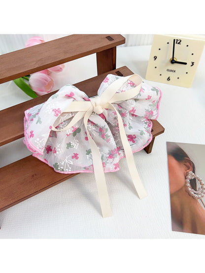 Top view of Beau Chic Sweet Bow Hair Clip showing symmetrical bow design