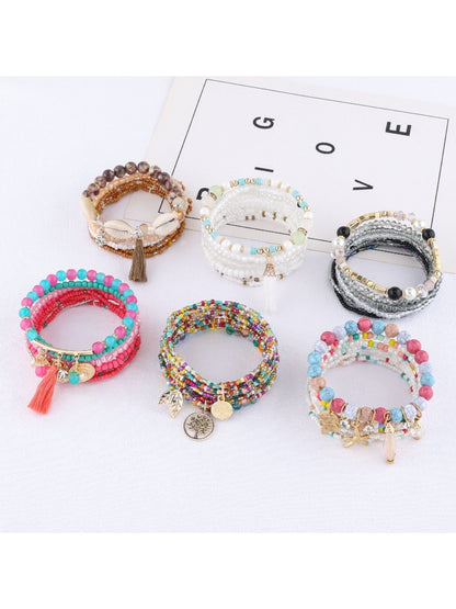 Lovra stackable bracelet worn on wrist with multiple colorful beads