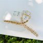 Beau floral cross hair claw clip packaged in a minimalist branded box