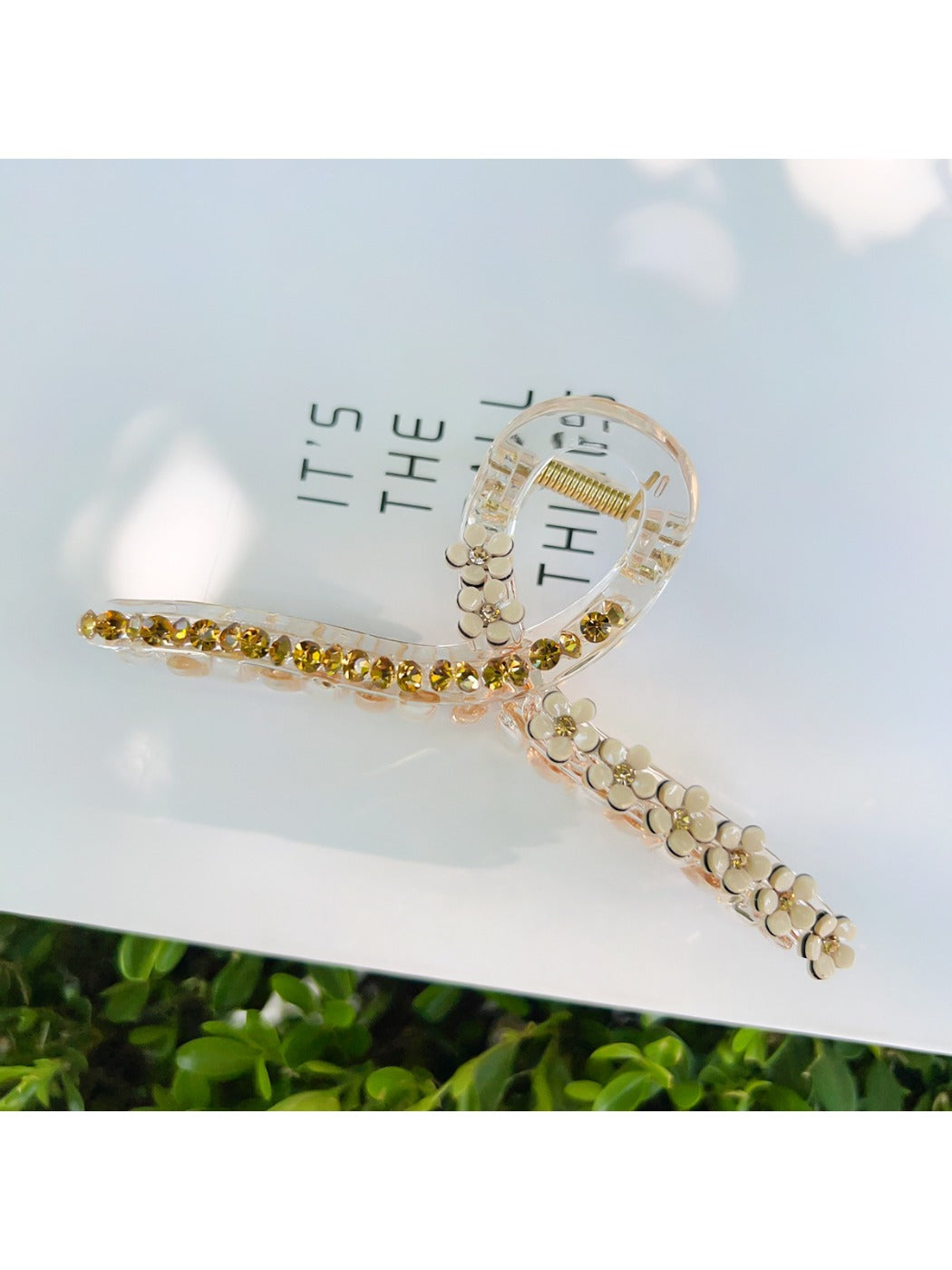 Beau floral cross hair claw clip packaged in a minimalist branded box