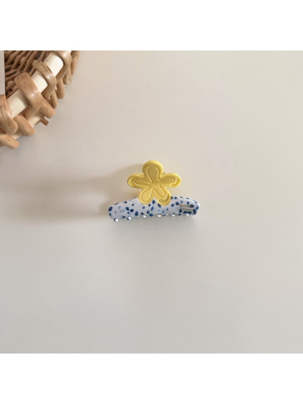 Beau acetate flower shaped hair clip shown from an angled perspective highlighting its shape