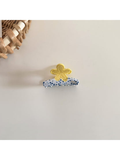 Beau acetate flower shaped hair clip shown from an angled perspective highlighting its shape