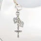 Side view of the vintage cross pendant keychain highlighting its thickness