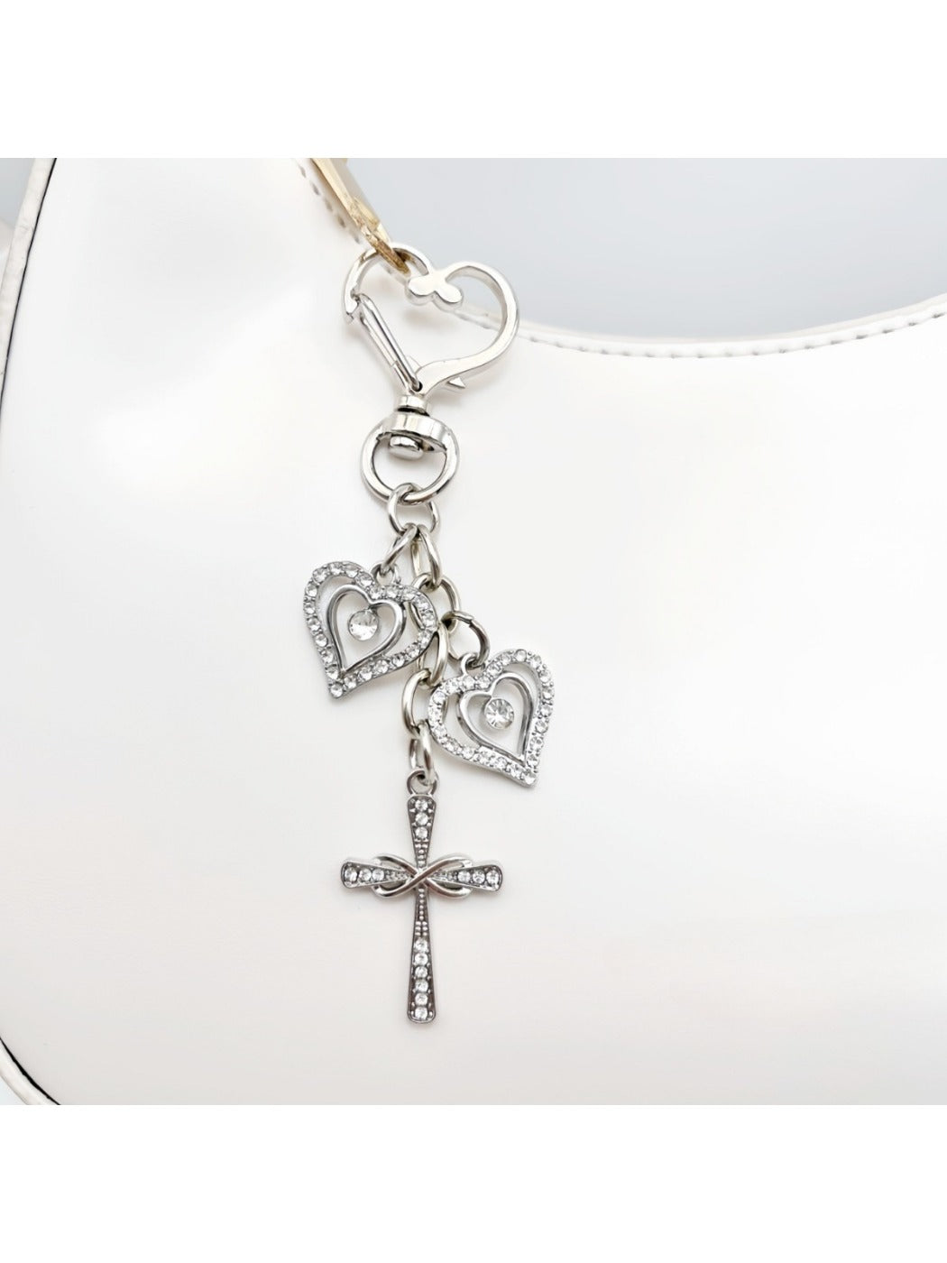Side view of the vintage cross pendant keychain highlighting its thickness