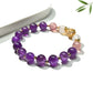 Lovra vintage purple beaded bracelet worn on wrist with natural lighting