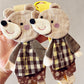 Side view of the fabric patchwork bear keychain highlighting its plush design