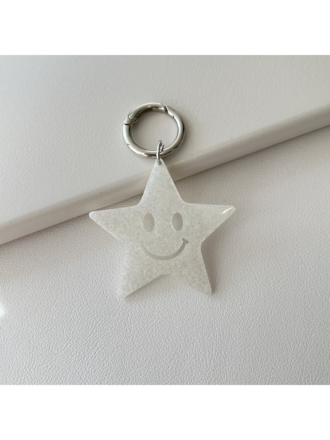 Star pendant keychain with a polished finish reflecting light