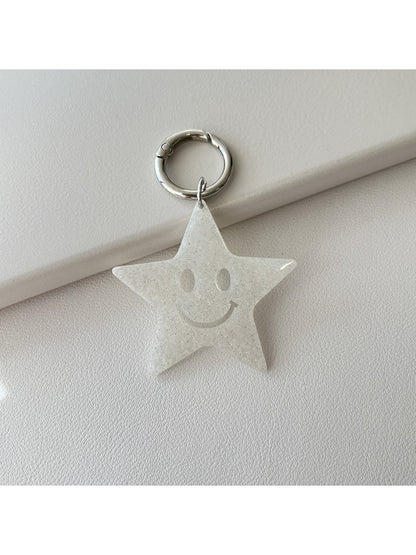 Star pendant keychain with a polished finish reflecting light