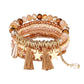 Set of Lovra stackable beaded bracelets featuring earth tones and metallic accents