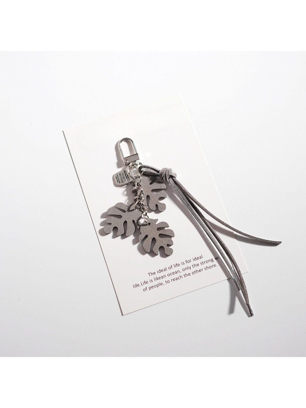 Side angle of Keypus creative leaf shaped keychain with metal ring