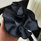 Gifty scrunchie displayed on a white background showing fabric texture