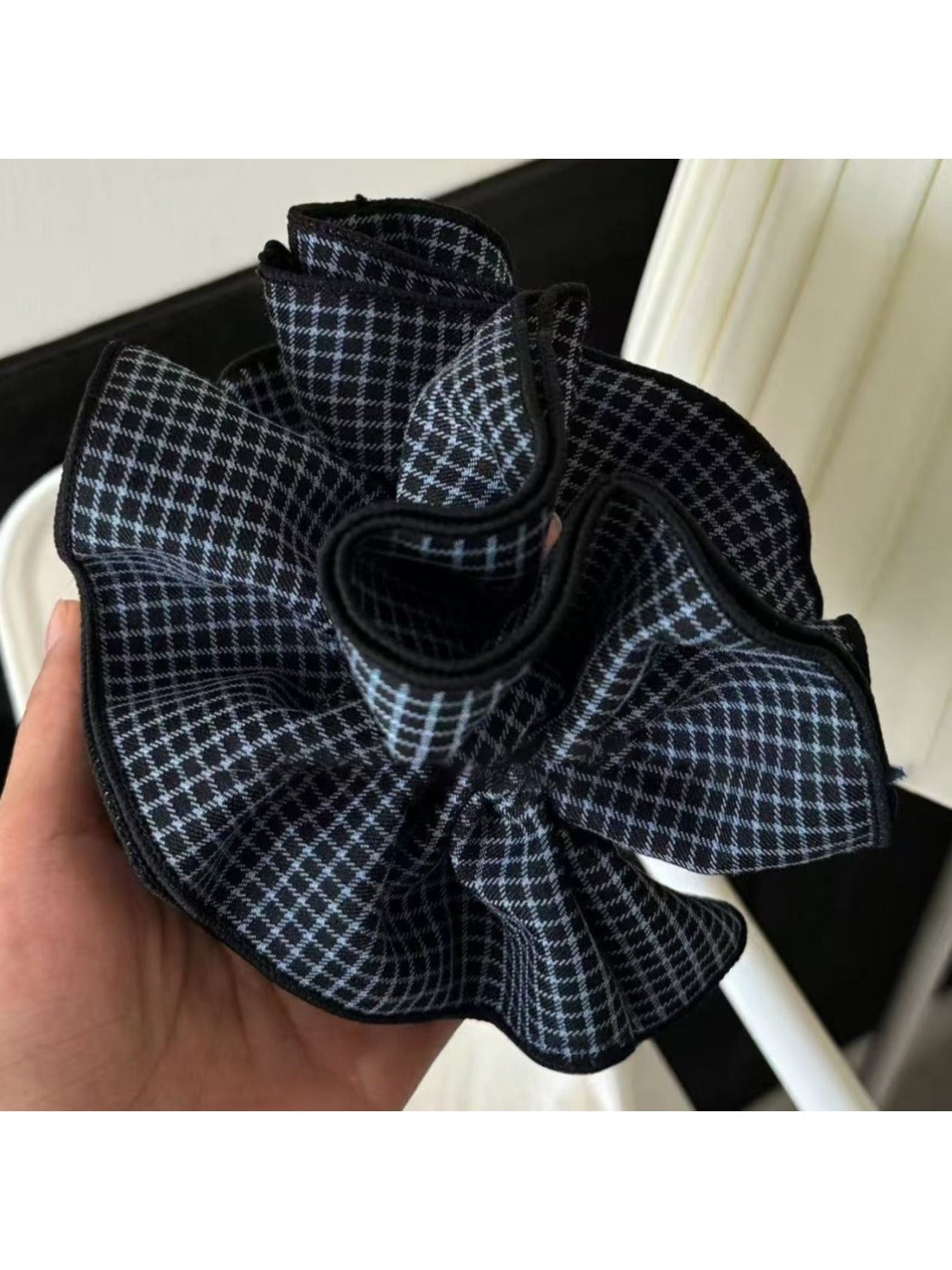 Gifty scrunchie displayed on a white background showing fabric texture