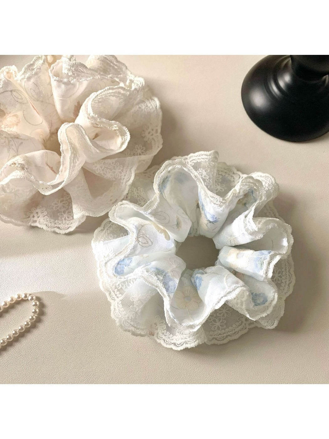 Gifty scrunchie displayed flat highlighting its circular shape and printed design