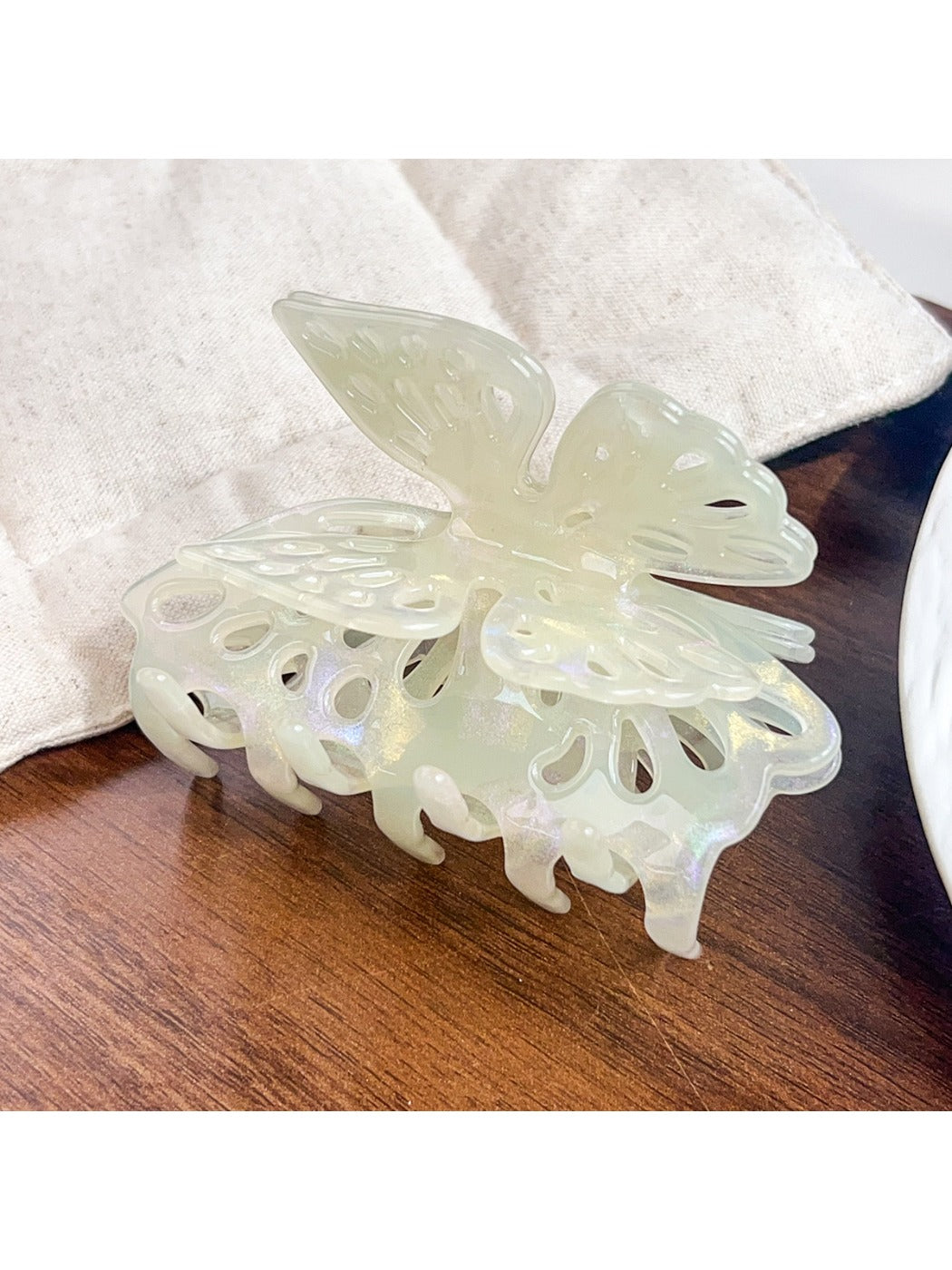 Beau butterfly hair claw clip styled in long brown hair from back view