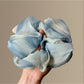 Gifty Chic dip dye scrunchie styled on a wrist with casual outfit