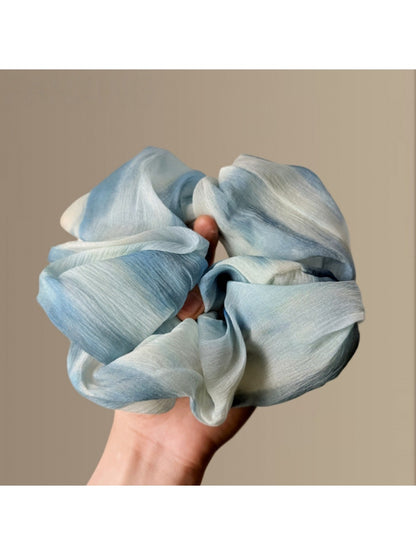 Gifty Chic dip dye scrunchie styled on a wrist with casual outfit