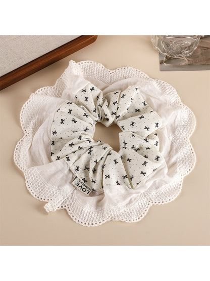 Side view of Gifty sweet printed patchwork scrunchie highlighting fabric texture