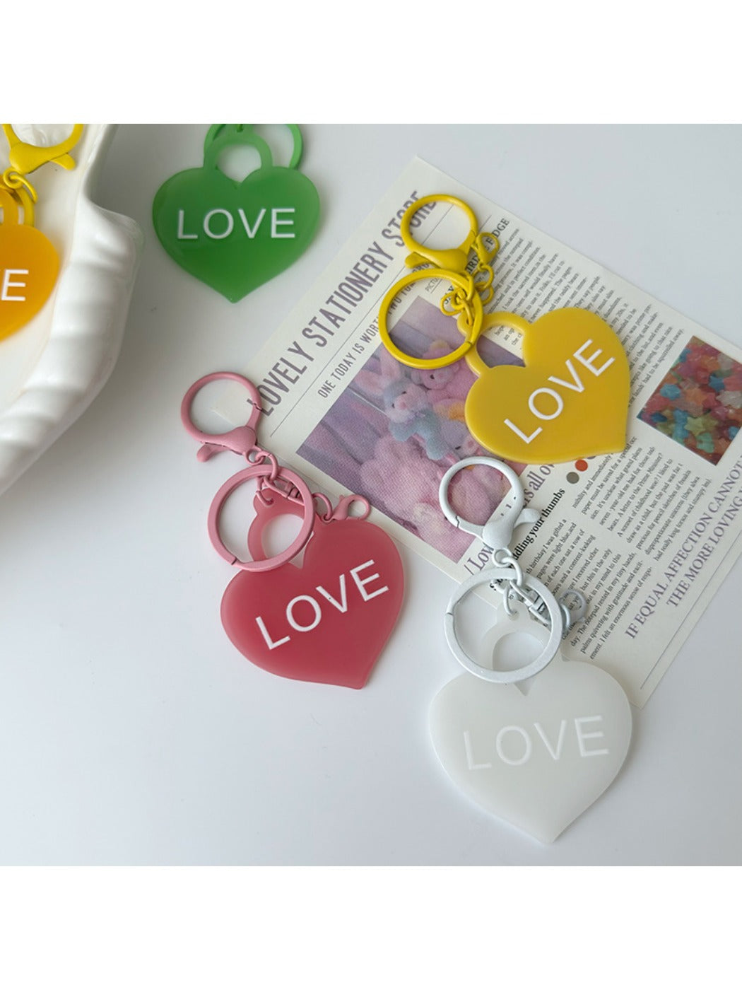 Close-up of red heart-shaped pendant keychain attached to a silver keyring