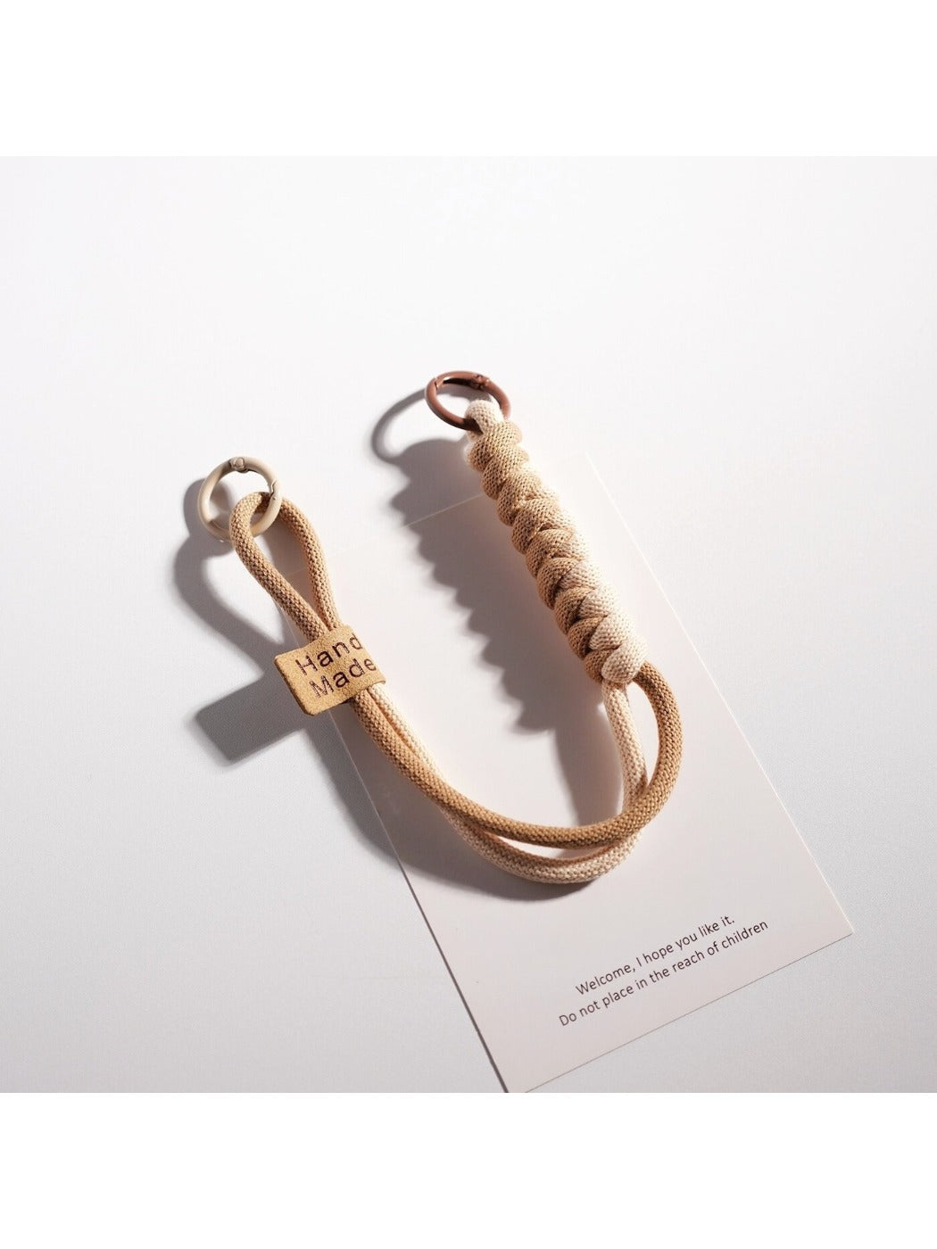 Minimalist rope keychain in multiple bright colors laid flat