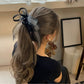 Close-up of Gifty layered ribbon scrunchie showing fabric texture and layers