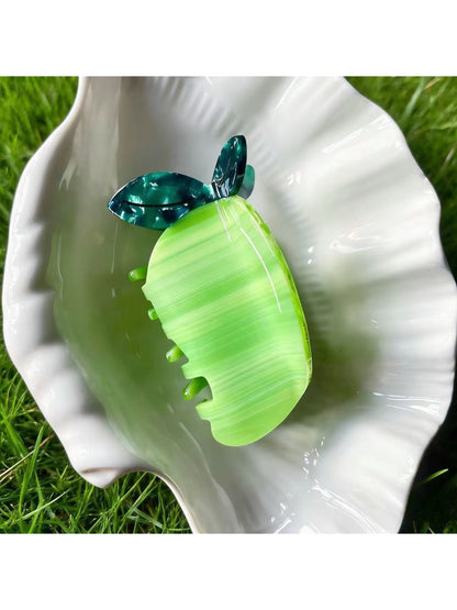 Beau acetate claw clip shaped like a green pear fruit with smooth finish