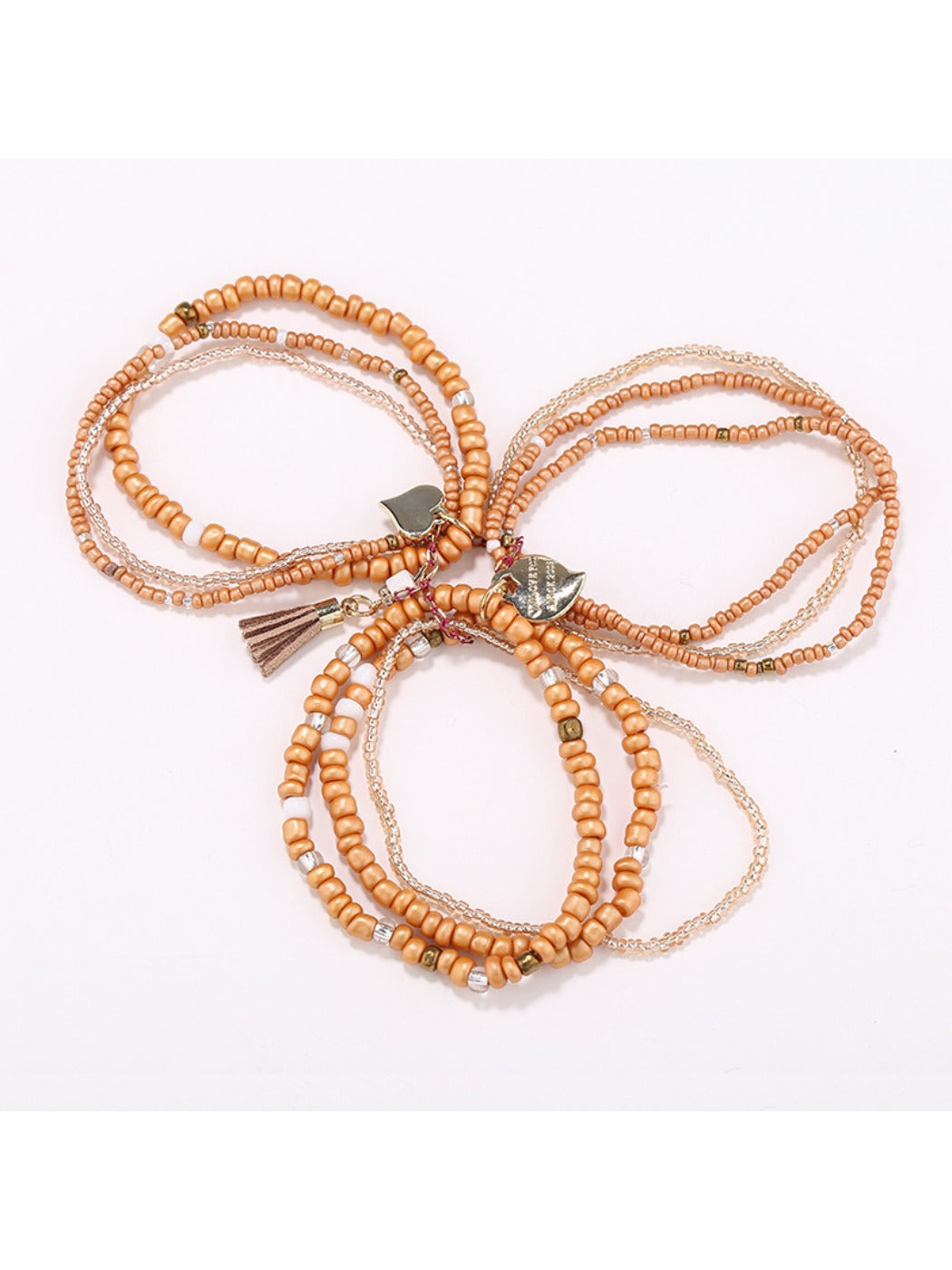 Close-up of Lovra bracelet showing detailed heart pendant and textured beads