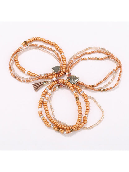 Close-up of Lovra bracelet showing detailed heart pendant and textured beads