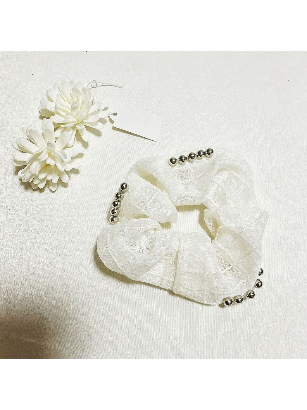 Gifty sweet cute lace scrunchie displayed flat showing intricate lace pattern